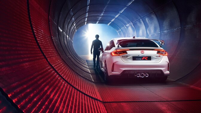 Rear three quarter Honda Civic Type R parked in a tunnel.