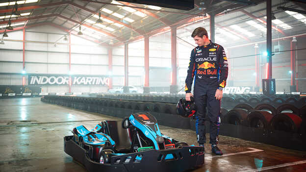 Max Verstappen looking at the indoor go karting kart.